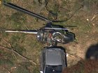 Helicopter crashes into car near Bankstown, killing one and leaving second person fighting for life.