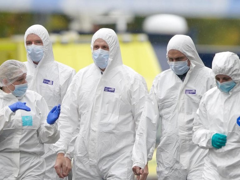 Forensic teams are examining the scene of a stabbing incident at a synagogue in Manchester. (AP PHOTO)