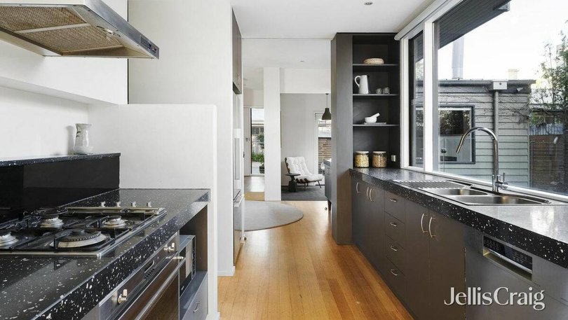The light-filled kitchen overlooks the backyard.