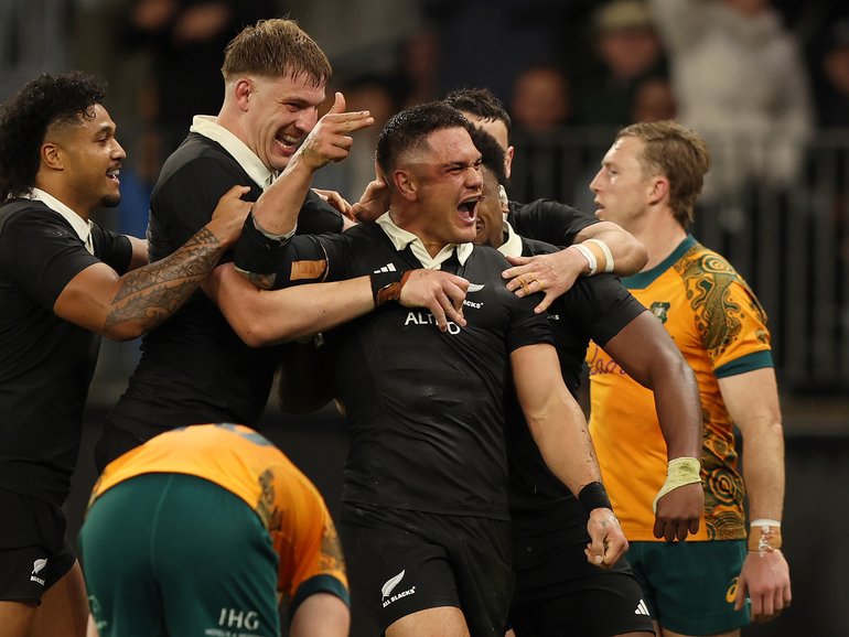 Quinn Tupaea of the All Blacks celebrates a try.