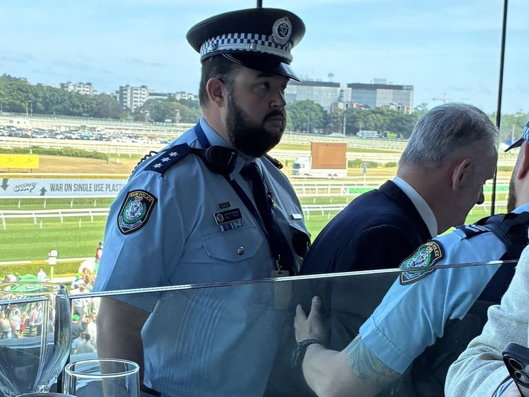Mr Latham was escorted out of Randwick Racecourse on Saturday. Supplied.