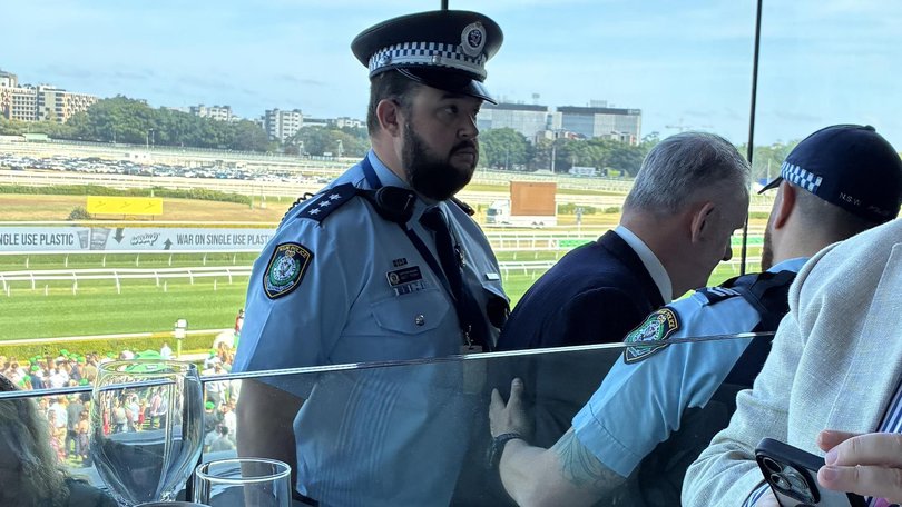 Mr Latham was escorted out of Randwick Racecourse on Saturday. Picture: Supplied.