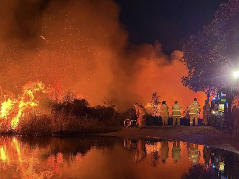 An out-of-control bushfire is burning in dense national park land on Moreton Island. (HANDOUT/Tamborine Mountain Rural Fire Brigade)