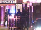 Heavily armed police stormed a business in Croydon Park.