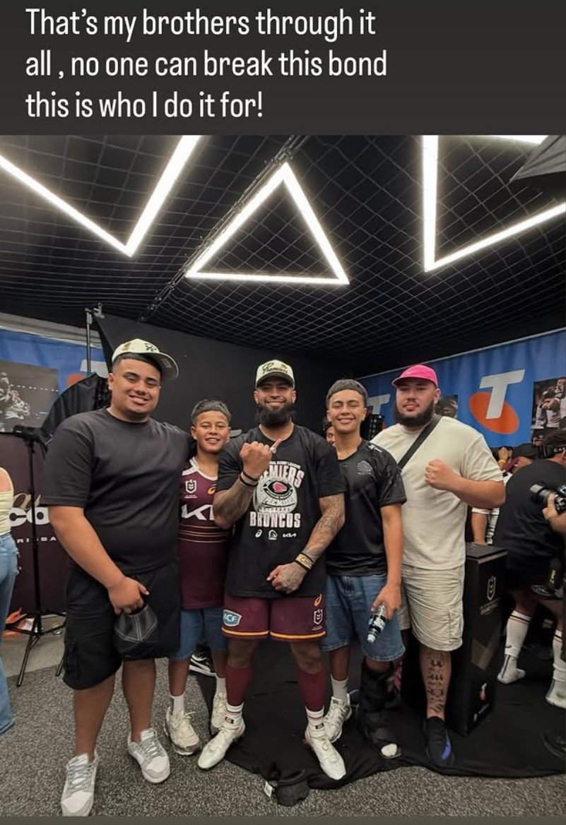Payne Haas celebrates the premiership with his family.