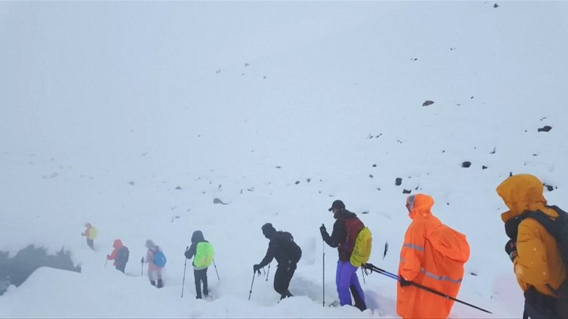 Rescue efforts are under way in the remote Tibetan slopes of Mount Everest where a snowstorm has trapped nearly 1,000 people in campsites on the eastern side of the mountain, according to Chinese state media. 