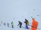 Rescue efforts are under way in the remote Tibetan slopes of Mount Everest where a snowstorm has trapped nearly 1,000 people in campsites on the eastern side of the mountain, according to Chinese state media. 