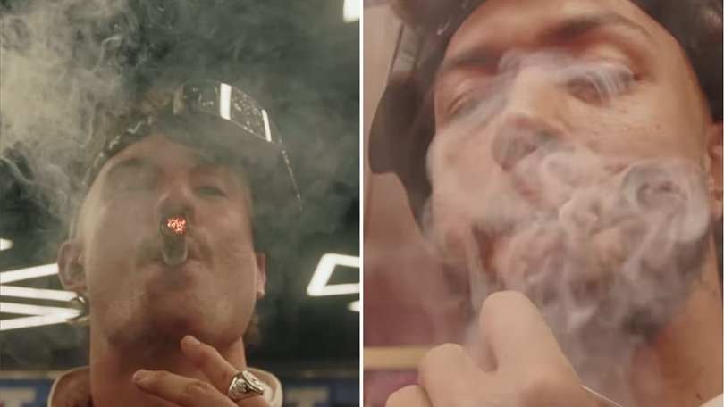 The boys light up: Broncos players are facing fines for smoking in the stadium.