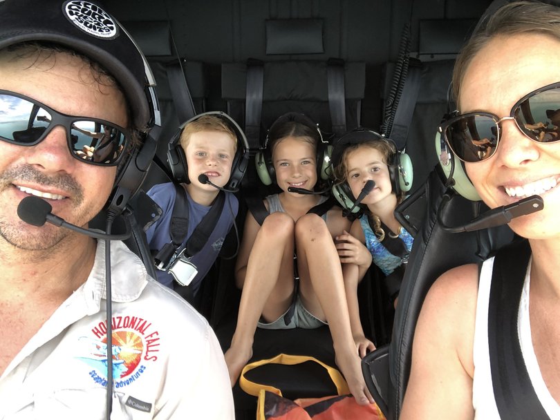 Troy and Sophie Thomas with their three children.