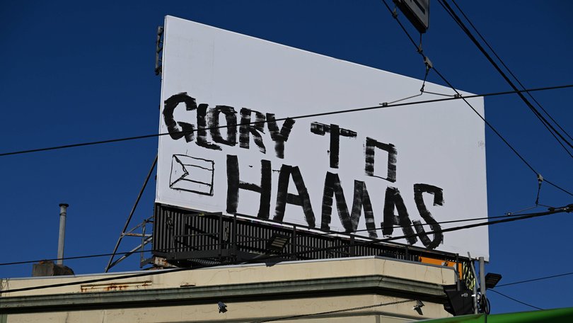 The graffiti on a bill board on thecorner of Brunswick Street and Alexandra Parade in Fitzroy.