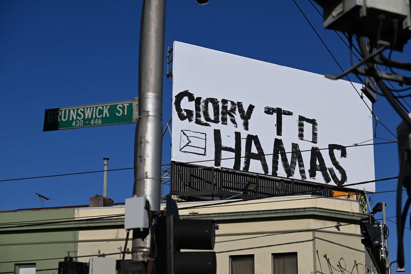 October 7, 2025. Graffiti on a billboard - Glory to Hamas - corner of Brunswick Street and Alexandra Parade in Fitzroy.