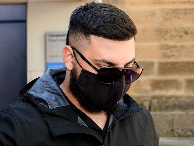 Adam Abdul-Hamid wore a black face mask throughout his court appearance over an alleged gang rape. 
