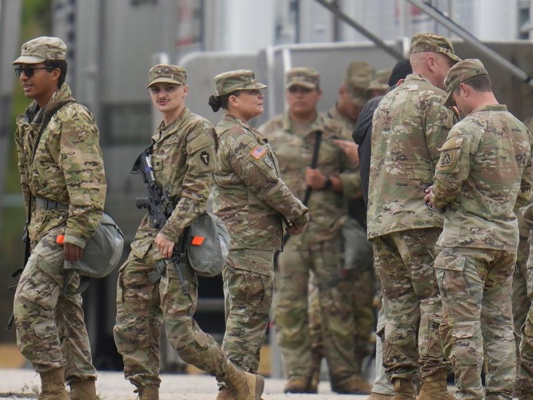 Texas National Guard troops assembled at an army reserve facility southwest of Chicago.