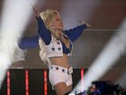 Dolly Parton dressed as a Cowboys cheerleader while performing during halftime of Dallas's game against the Washington Commanders in 2023.