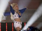 Dolly Parton dressed as a Cowboys cheerleader while performing during halftime of Dallas's game against the Washington Commanders in 2023.