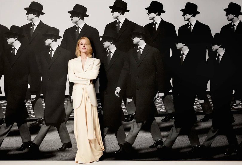Nicole Kidman in lily white blazer and matching skirt.