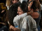Relatives and supporters of Israeli hostages held by Hamas in the Gaza Strip celebrate after the announcement that Israel and Hamas have agreed to the first phase of a peace plan, as they gather at a plaza known as the hostages square in Tel Aviv, Israel, Thursday, Oct. 9, 2025. (AP Photo/Emilio Morenatti)