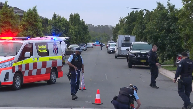 Two gunmen fired shots from a red Audi before speeding away.
