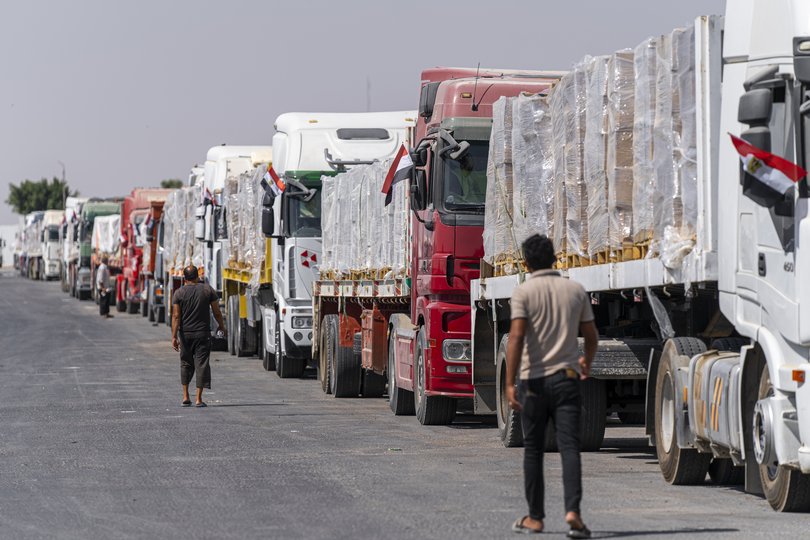 FILE: Trucks loaded with humanitarian aid waiting in front of the Rafah border crossing.