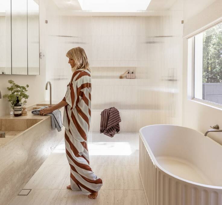 Ellie Watson's stunning bathroom with concrete bath. Pic: ABI Interiors
