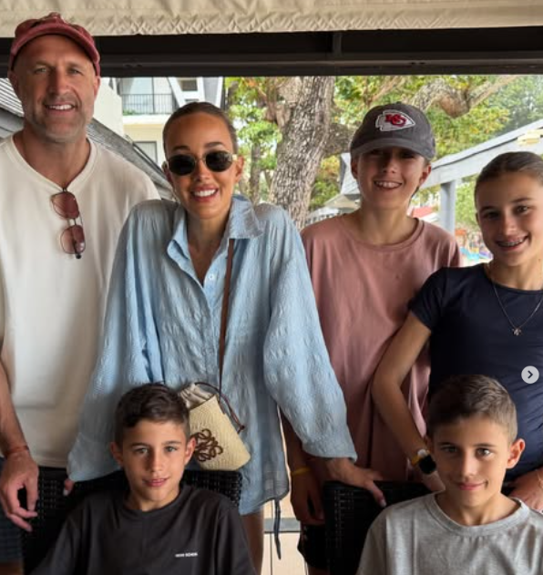 Bec Judd and her husband Chris with their four children.