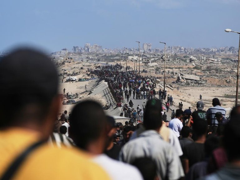 A massive column of displaced Palestinians is heading to northern Gaza as the ceasefire sets in. (AP PHOTO)