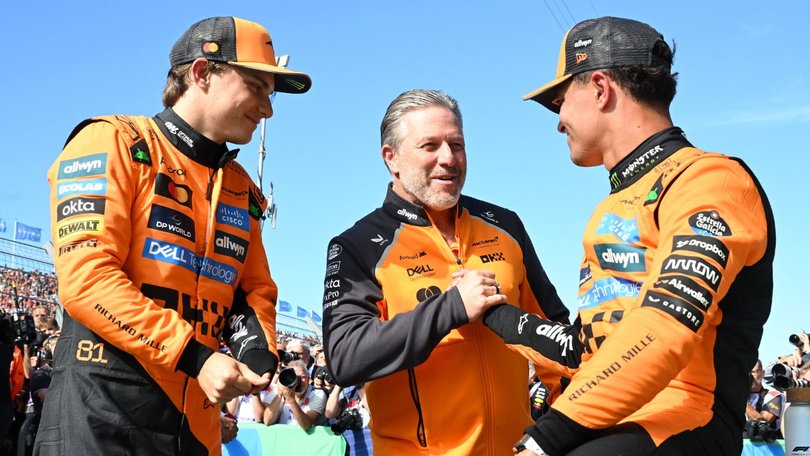Oscar Piastri with McLaren boss Zak Brown and teammate Lando Norris.