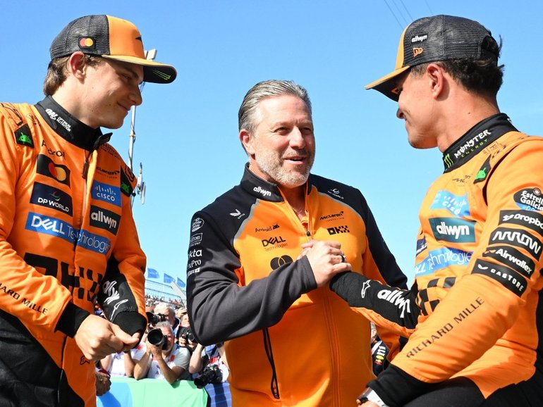 Oscar Piastri with McLaren boss Zak Brown and teammate Lando Norris.