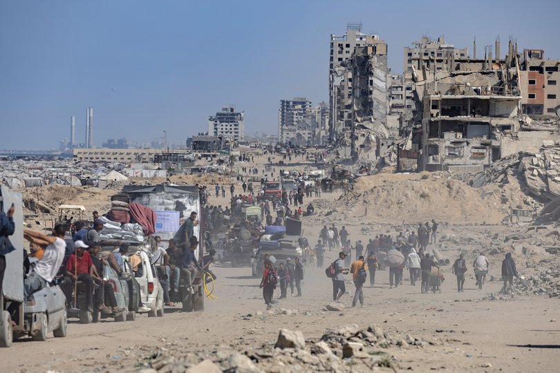 Thousands of people travelled by foot toward Gaza City on Saturday as a ceasefire held overnight.