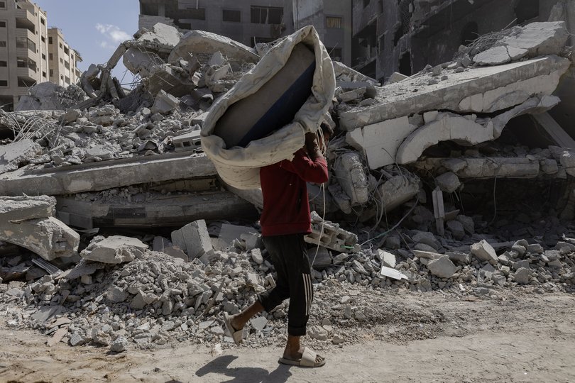 Many were trying to retrieve whatever furniture they could from the rubble.