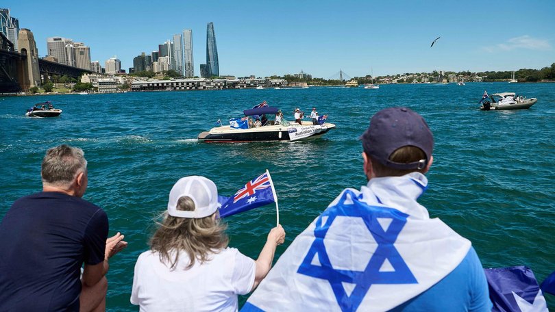 Dozens of protesters lined the shore. Picture: NewsWire / Flavio Brancaleone