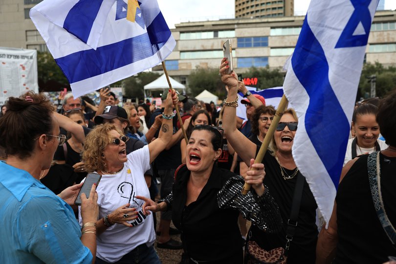 Israelis celebrate news of the Gaza peace deal at Hostages Square on October 9.