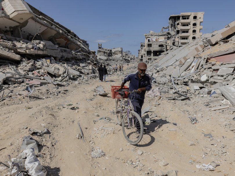 Palestinians return to inspect their destroyed homes in the Tal al-Hawa area, southwest of Gaza City, Oct. 11, 2025.