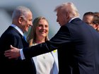 US President Donald Trump is welcomed by Israeli Prime Minister Benjamin Netanyahu (L) at Ben Gurion International Airport on October 13, 2025 in Tel Aviv, Israel.