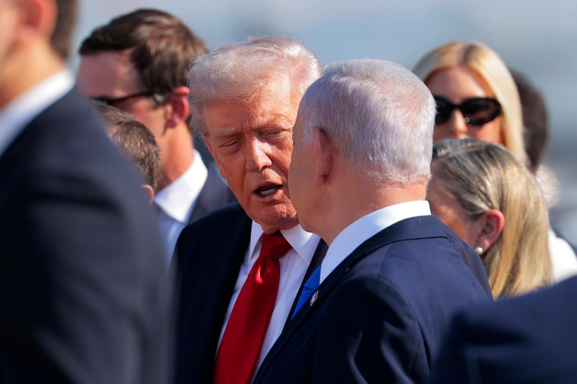 TEL AVIV, ISRAEL - OCTOBER 13: U.S. President Donald Trump (C) is welcomed by Israeli Prime Minister Benjamin Netanyahu at Ben Gurion International Airport on October 13, 2025 in Tel Aviv, Israel. President Trump is visiting the country hours after Hamas released the remaining Israeli hostages captured on Oct. 7, 2023, part of a US-brokered ceasefire deal to end the war in Gaza. (Photo by Chip Somodevilla/Getty Images) Picture: Chip Somodevilla