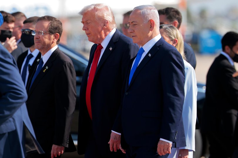 TEL AVIV, ISRAEL - OCTOBER 13: U.S. President Donald Trump (C) is welcomed by Israeli Prime Minister Benjamin Netanyahu at Ben Gurion International Airport on October 13, 2025 in Tel Aviv, Israel. President Trump is visiting the country hours after Hamas released the remaining Israeli hostages captured on Oct. 7, 2023, part of a US-brokered ceasefire deal to end the war in Gaza. (Photo by Chip Somodevilla/Getty Images) Picture: Chip Somodevilla