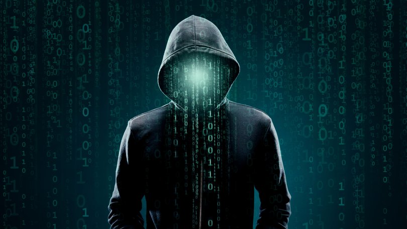 Portrait of computer hacker in hoodie. 