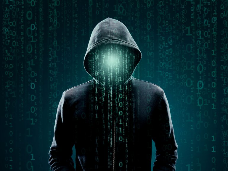 Portrait of computer hacker in hoodie. 