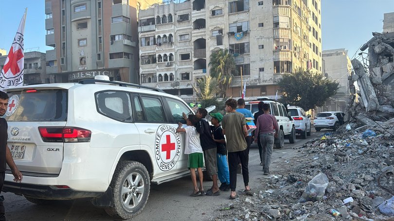 Hamas members hand over some of the 20 Israeli hostages to International Committee of the Red Cross (ICRC) teams as part of the ceasefire and prisoner and hostage swap deal between Hamas and Israel in Gaza City, Gaza, on October 13, 2025.