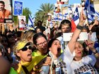 People react as they watch the hostage release live stream at Hostages Square on October 13, 2025 in Tel Aviv, Israel.