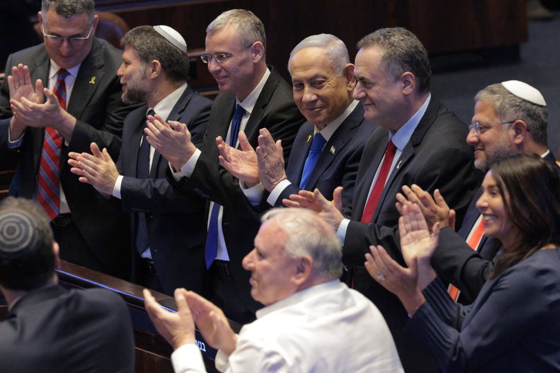 Israeli Prime Minister Benjamin Netanyahu applauds while U.S. President Donald Trump addresses the Knesset, Israel’s parliament, on October 13, 2025 in Jerusalem.