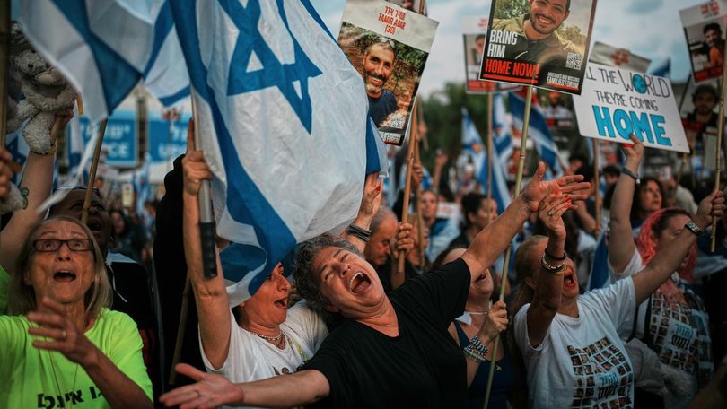 Israelis have gathered in Hostages Square in Tel Aviv to watch the return of the hostages. (AP PHOTO)