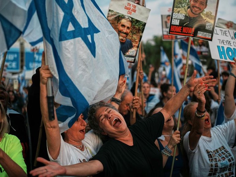 Israelis have gathered in Hostages Square in Tel Aviv to watch the return of the hostages. (AP PHOTO)