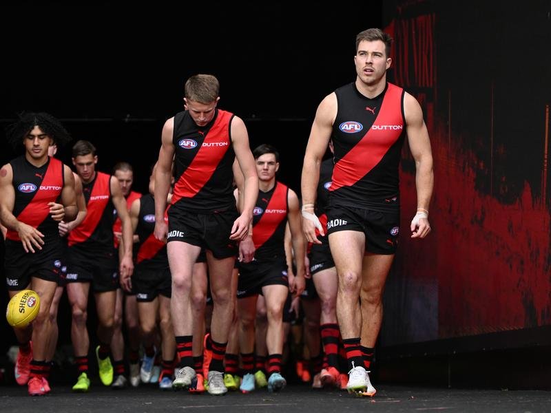 Essendon captain Zach Merrett (right) is in trade limbo.