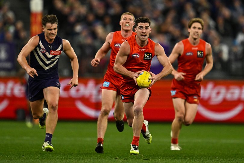 PERTH, AUSTRALIA - SEPTEMBER 06: Brayden Fiorini of the Suns runs with the ball during the AFL Second Elimination Final match between the Fremantle Dockers and the Gold Coast Suns at Optus Stadium on September 06, 2025 in Perth, Australia. (Photo by Daniel Carson/AFL Photos)