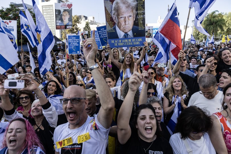 Thousands of people celebrate Monday as they watch a live broadcast of Israeli hostages released from captivity in Gaza.