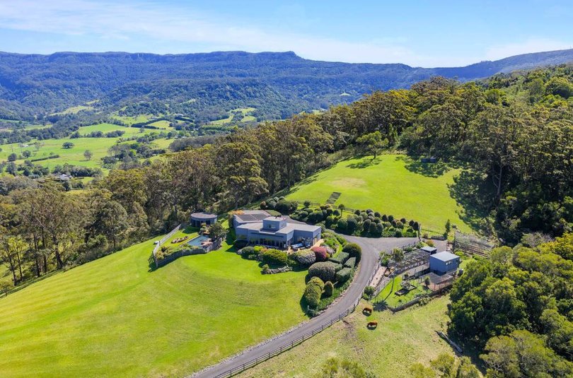 The property features a helipad and a working farm.