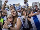 People gathered at Hostages Square in Tel Aviv, Israel, cheer the release of hostages held by Hamas in Gaza.