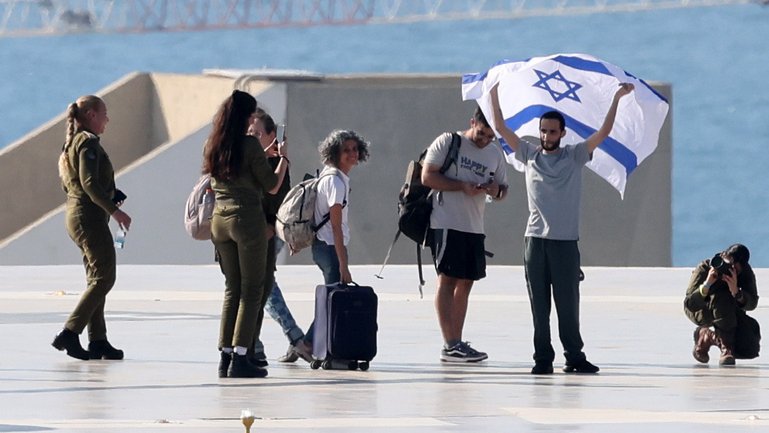 Vicki Cohen, second from left, with her son Nimrod, right, following his release from Hamas captivity. 