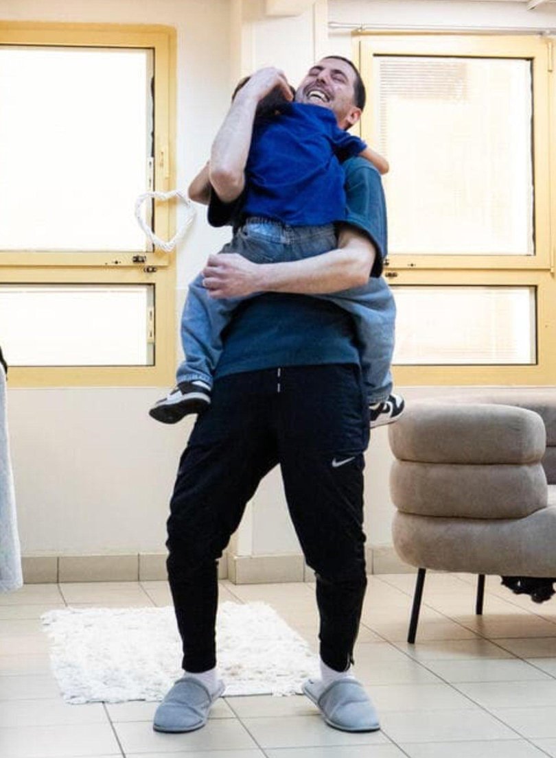 Elkana Bohbot’s five-year-old son, Reem, runs into the room.